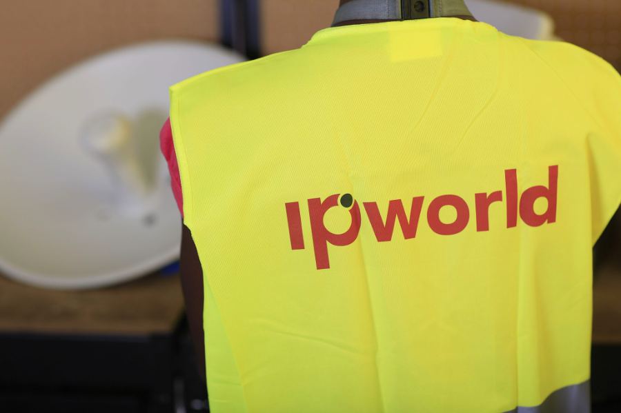 Vest with the IP World logo next to a communications antenna
